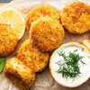 Crispy golden crab cakes with tropical dipping sauce.