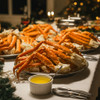 Platters piled with golden king crab legs.