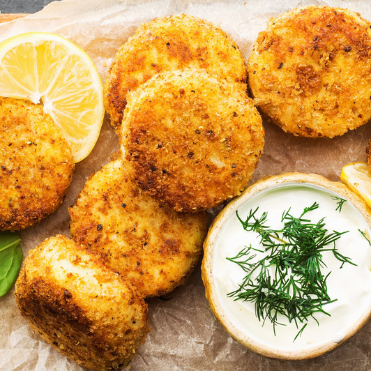 Crispy golden crab cakes with tropical dipping sauce.