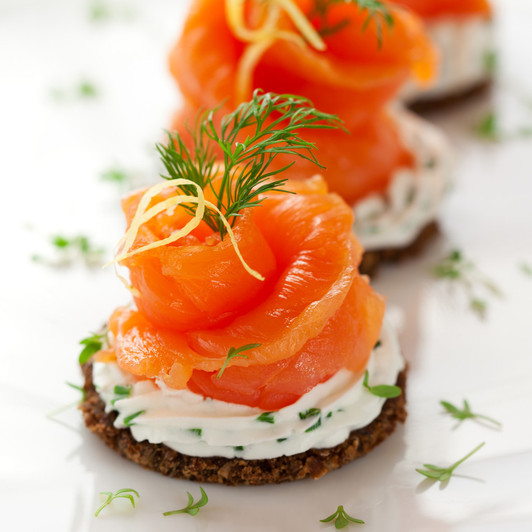 Sliced Alaska sockeye lox cracker appetizer. Sliced Alaska sockeye lox cracker appetizer.