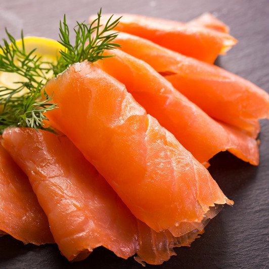 Sliced smoked Alaska sockeye lox with garnish. Sliced smoked Alaska sockeye lox with garnish.