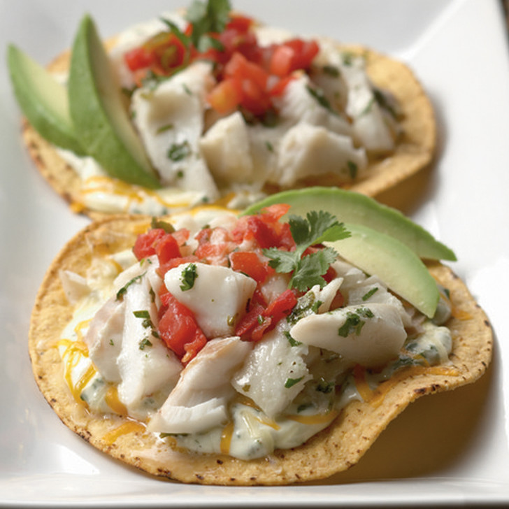 Alaska Cod tostados with sliced avocados.