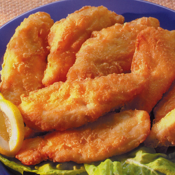 Pubhouse battered halibut fillets with lemon wedge.