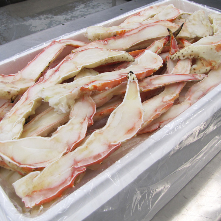 Case of split colossal red king crab legs & claws.