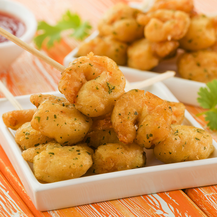 Golden Alehouse shrimp in serving platters with dipping sauce.