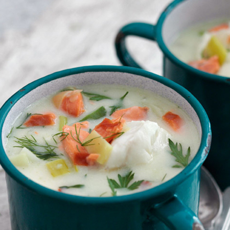 Alaska cod & smoked salmon chowder in blue metal coffee cups