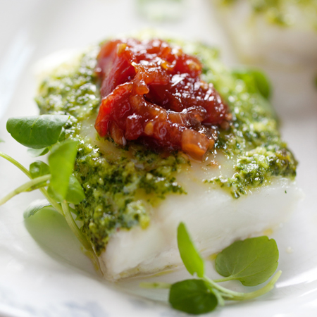 Roasted cod fillet draped in kale pesto topped with tomato jam