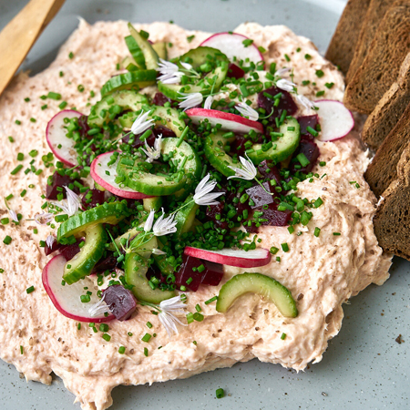 Salmon spread topped with chopped cucumber, beets, & chives