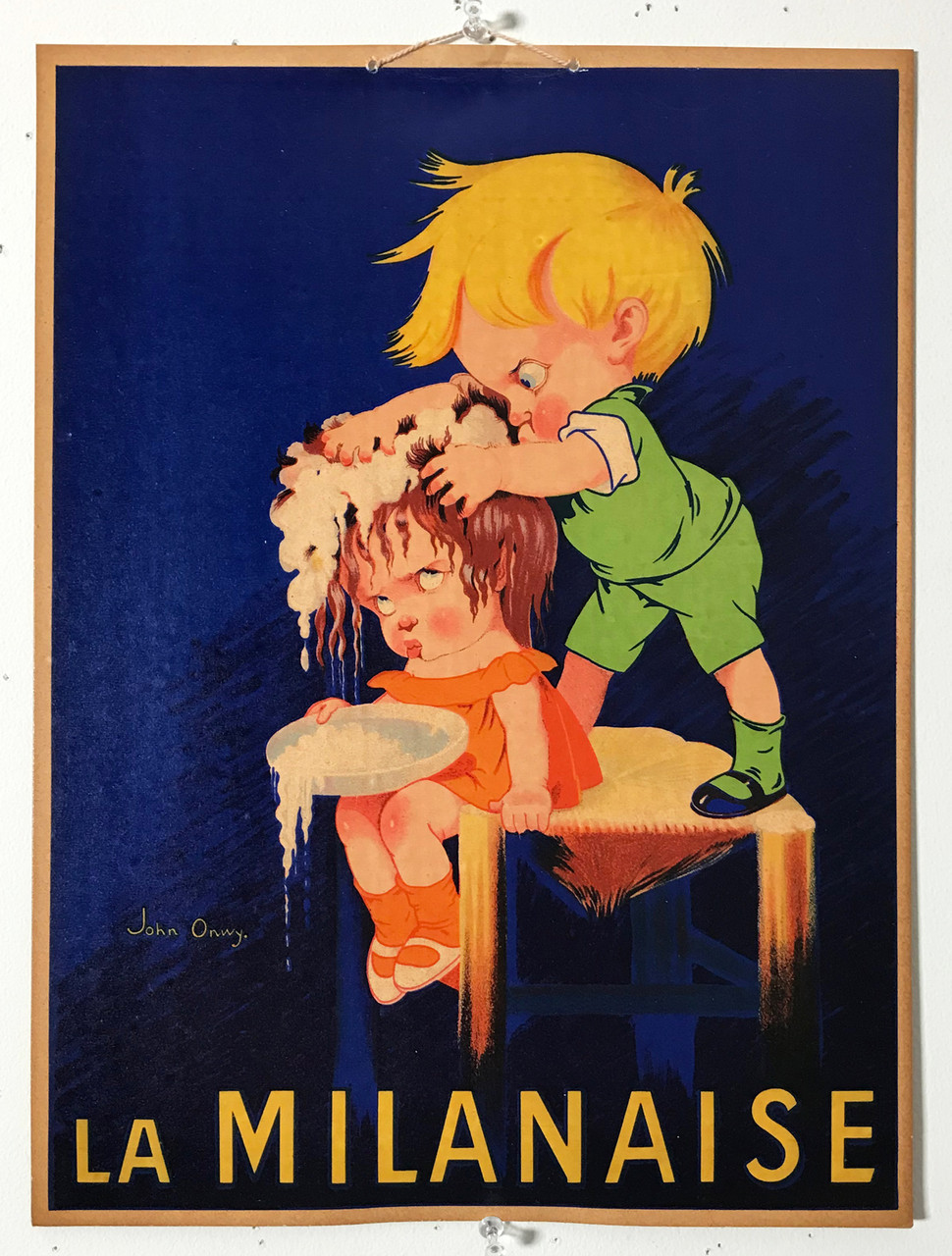 La Milanaise by John Onwy Original 1930 Vintage Shampooo Advertisement In Store Display Lithograph Poster on Cardboard. Shows  a boy dressed in green standing on a chair washing a girls hair who wears orange.