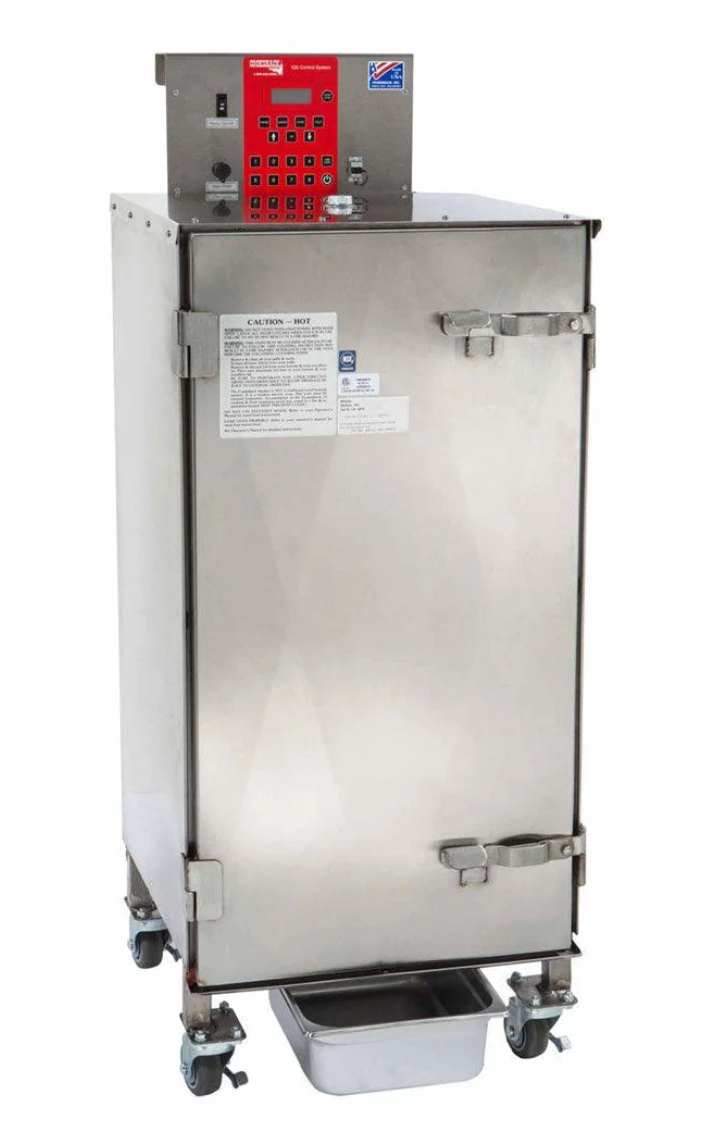 Model SM160 is ideal for operations which need to produce a moderate amount of smoked foods and/or barbecue.  
It produces hot or cold smoked foods by application of heat and wood smoke to meat, poultry, fish, and vegetables.  
The heating unit works only when the smoker door is closed.
Food cooks at a low temperature with no drying drafts of air moving through the smoker.  
The SM160 smoker is designed to be used inside with outside ventilation for smoke. 
Place under a hood, near an outside exhaust fan, or attach a Cookshack Smoke hood.  
Meat drippings exit the bottom of the smoker into a removable drip pan for clean, safe operation.  Inner accessories remove for easy cleaning.  
Safe, contained wood box slides out.