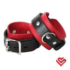 A photo of the Dreamers Signature Leather Wrist Restraints - Red & Black
