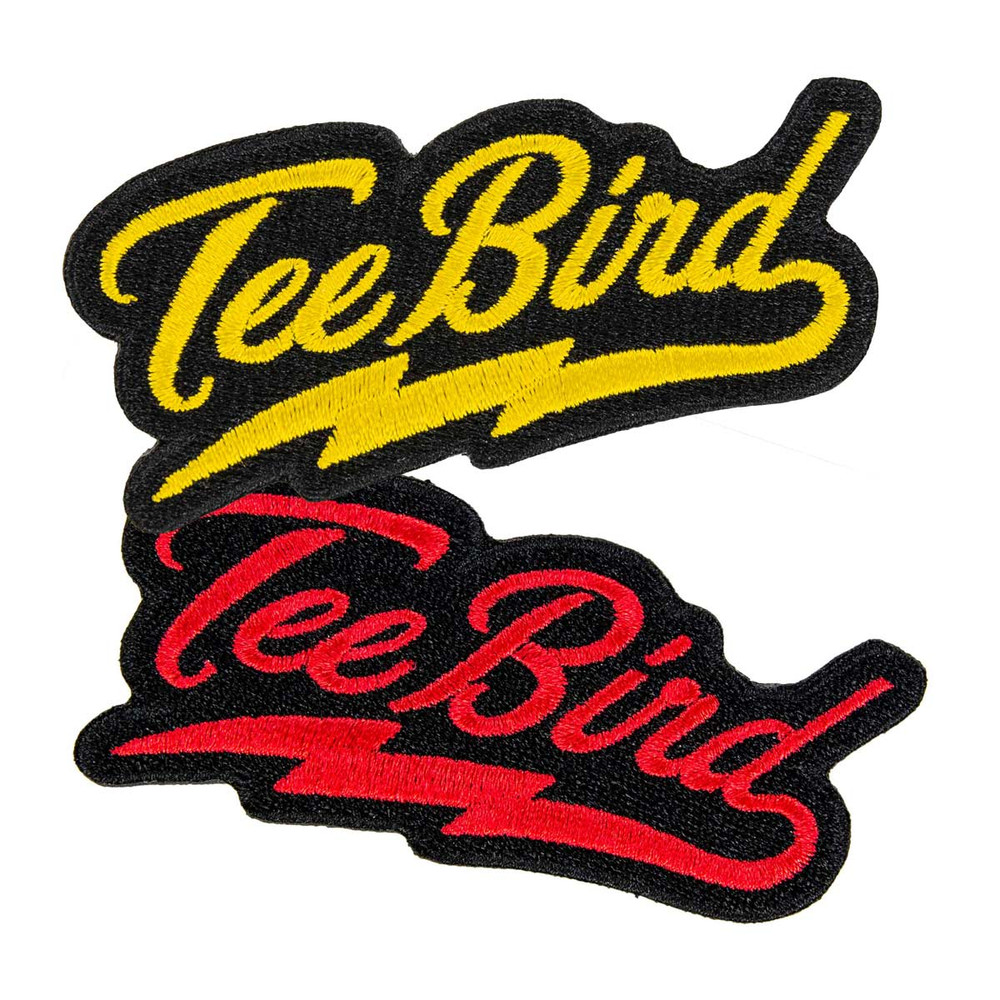 Two patches are shown spread out vertically and overlapping slightly. They both say "TeeBird" in cursive lettering with a lightning bolt curl underlining the word that comes off of the letter d. The top one is yellow, the bottom is red.