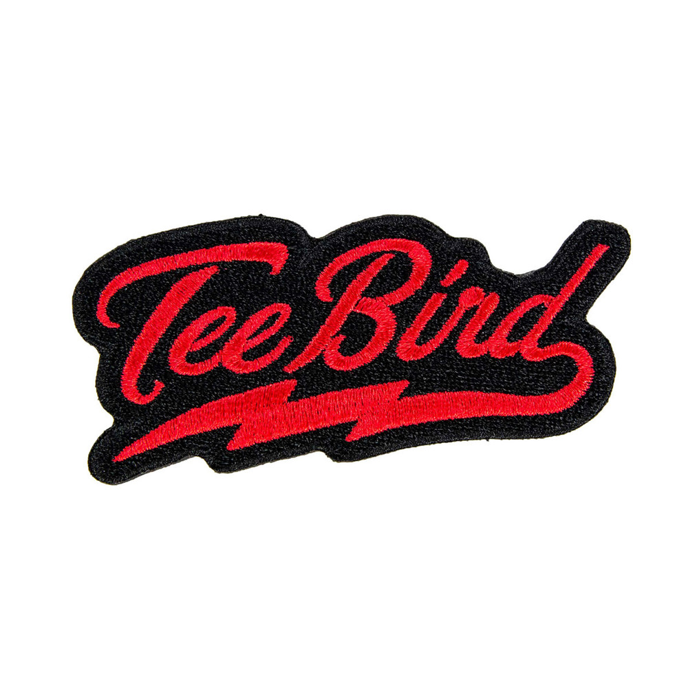 A patch is shown that says "TeeBird" in cursive red lettering with a lightning bolt curl underlining the word that comes off of the letter d.