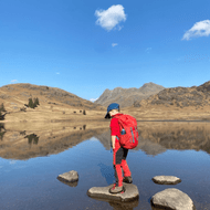 When can kids start carrying a backpack on hikes?