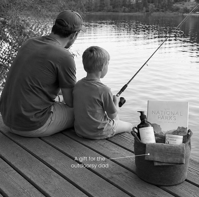 Father and son fishing together on a dock