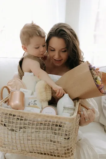 Mother and baby with gift basket