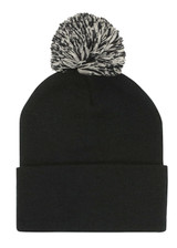 Acrylic beanie in black with a black and white pom pom on top. Features a folded cuff and has a logo.