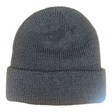 A grey knitted beanie with a 6-seam design and a folded cuff, featuring a logo.