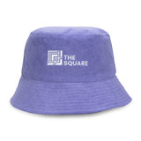A purple reversible twill/terry bucket hat featuring a logo on the front.