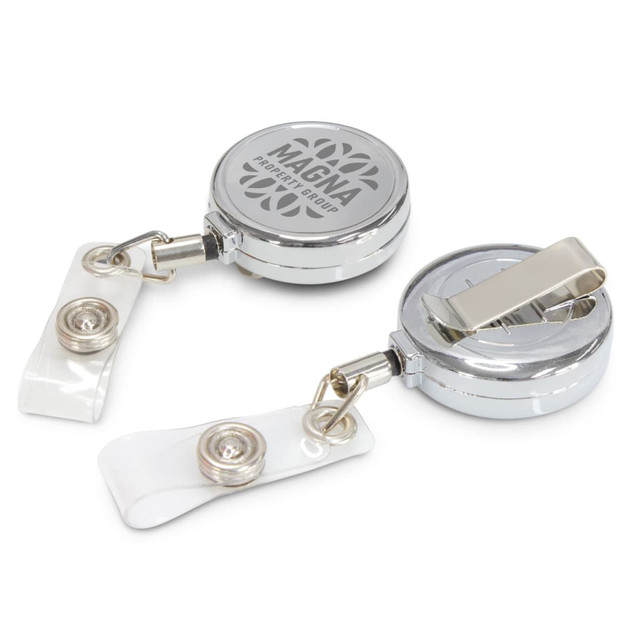A silver retractable ID holder with a clip and clear strap, featuring a logo on the surface.