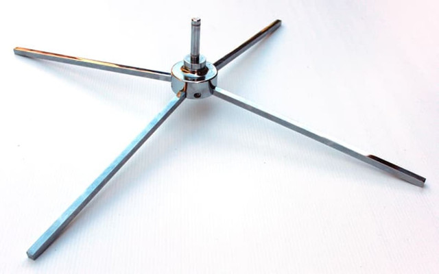A metallic, retractable cross base featuring four elongated arms, designed for stability and support.