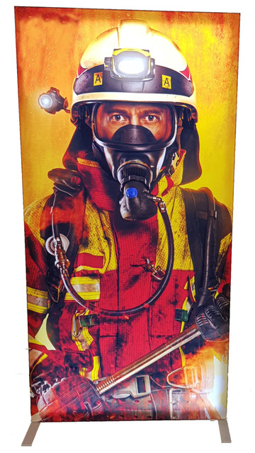 A promotional light box featuring a firefighter in vibrant yellow and red gear, with a dramatic fiery background.