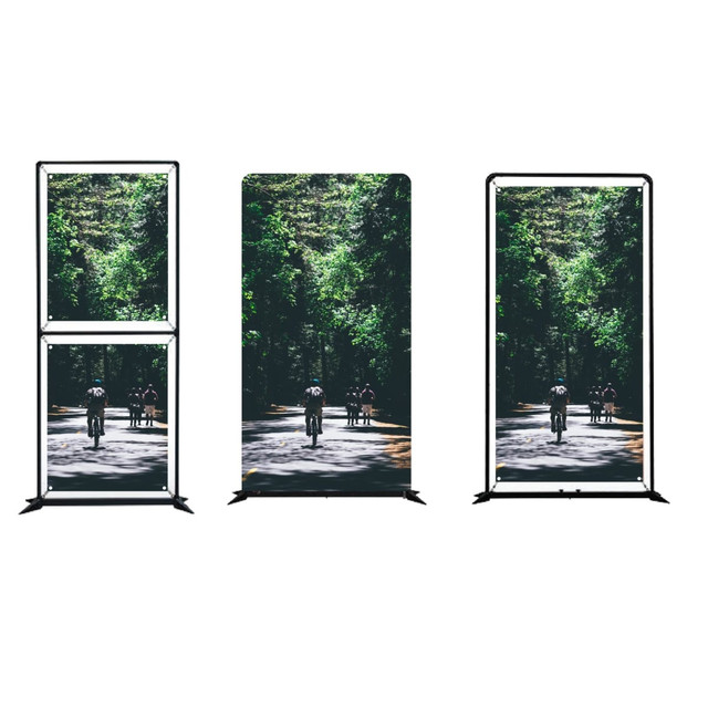 A multi-purpose floor display with a black frame, featuring a vibrant nature scene with cyclists on a forest path.