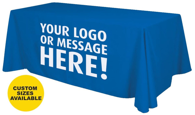 A blue table cover drapes over an 8-foot table, featuring a logo on the front. Custom sizes available.