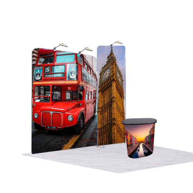 A red double-decker bus and Big Ben feature on fabric displays, with a black table in front.