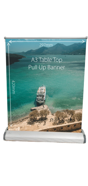 A table top pull-up banner featuring a scenic view of a boat by a turquoise sea, with mountains in the background.
