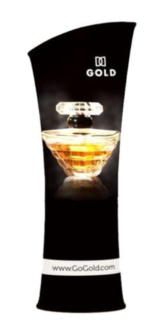 A promotional tension fabric display featuring a curved tower design with a gold perfume bottle image, predominantly black.