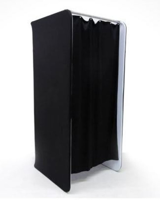 A black tension fabric change room with a white frame and four curtain panels. It features a logo.