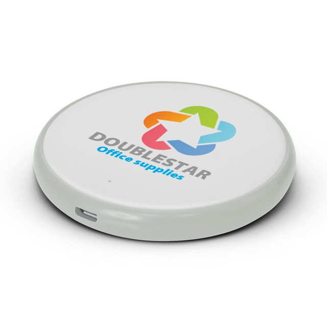 A round white wireless charger with a light green rim and a multicoloured logo.