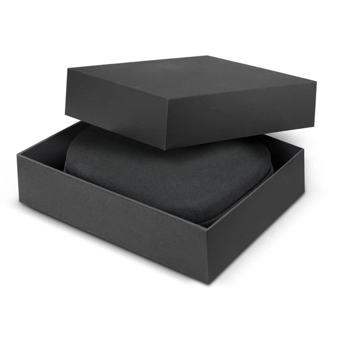 A black box partially open, revealing a pair of black noise-cancelling headphones inside.