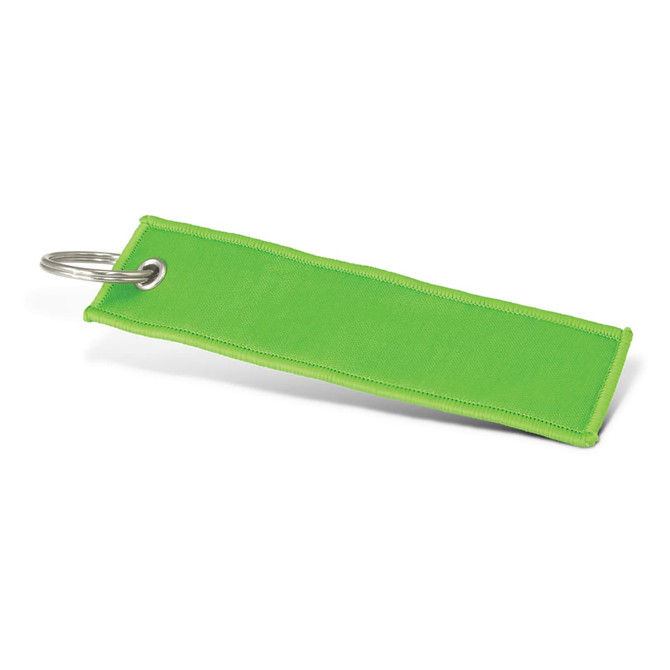 A green woven key ring featuring a metal ring for attachment. It has a simple, flat design.