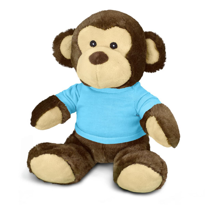 A plush monkey toy in brown and cream, wearing a blue T-shirt, seated with arms outstretched.
