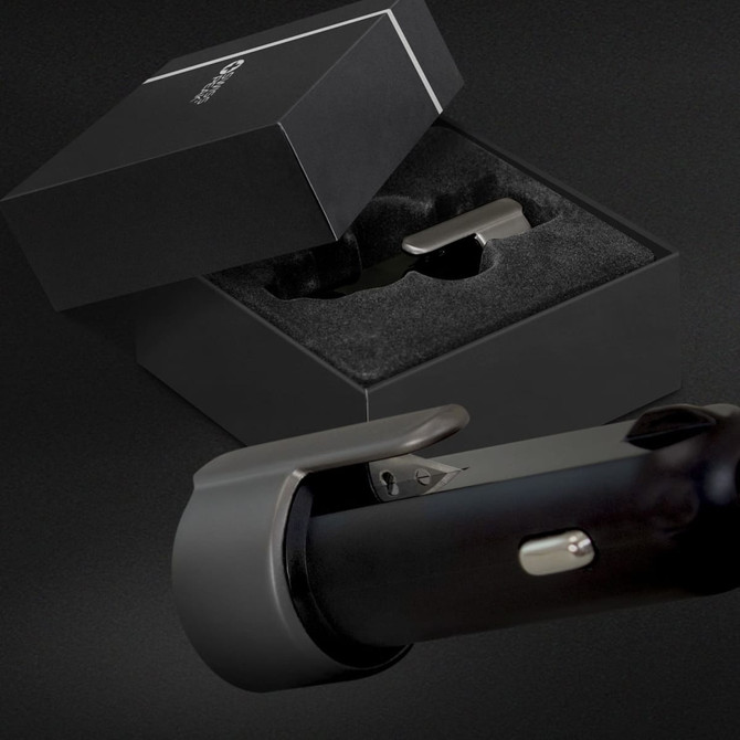 A Swiss Peak 3-in-1 safety charger in a sleek black box with a soft interior, featuring a metallic finish.