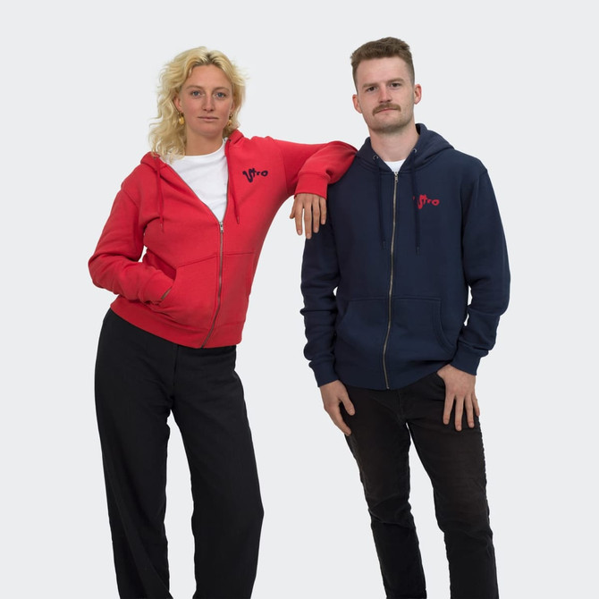 A red unisex hoodie and a navy unisex hoodie worn by two models, standing side by side, with a logo on each.