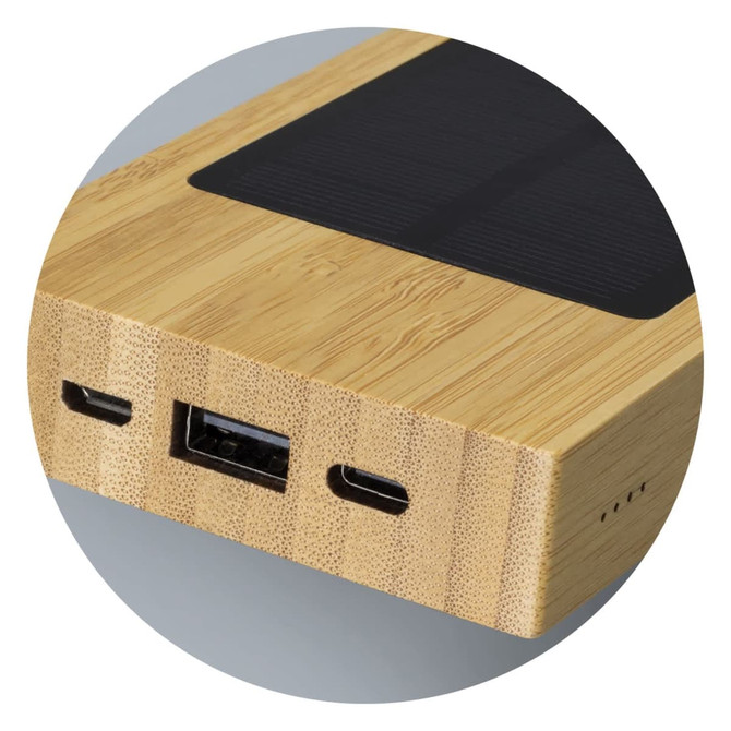 A bamboo solar power bank featuring USB and USB-C ports, with a textured surface and a sleek design.