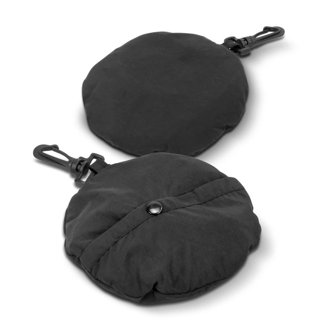 A packable bucket hat in black, displayed in a folded round shape with a clip. Features a logo.
