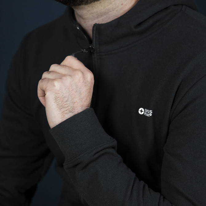 A black hoodie featuring a zip fastening and a small logo on the chest.