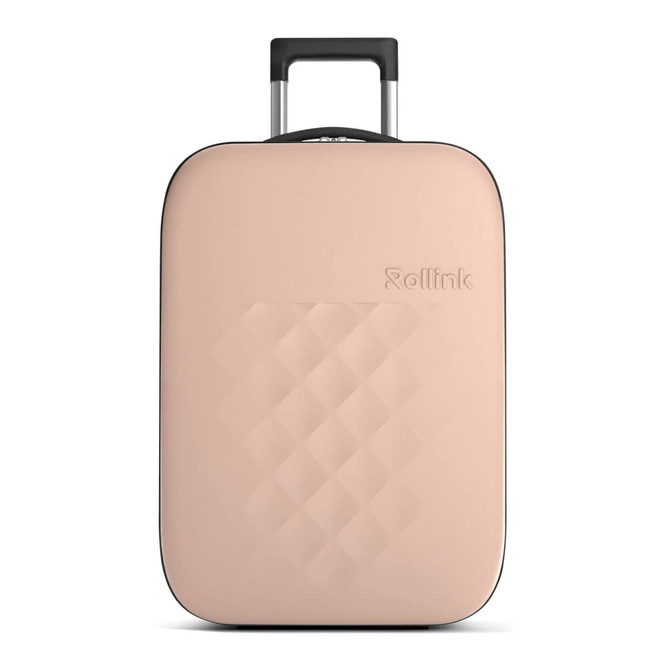 A wheeled suitcase in a soft beige colour with a textured surface and a retractable handle. It features a logo.