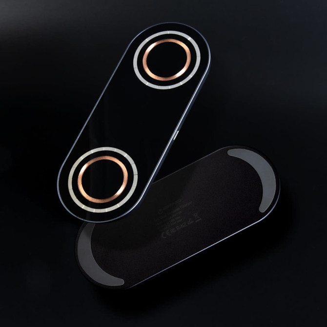 A sleek black wireless charger with dual charging pads, featuring rose gold accents and a minimal design.