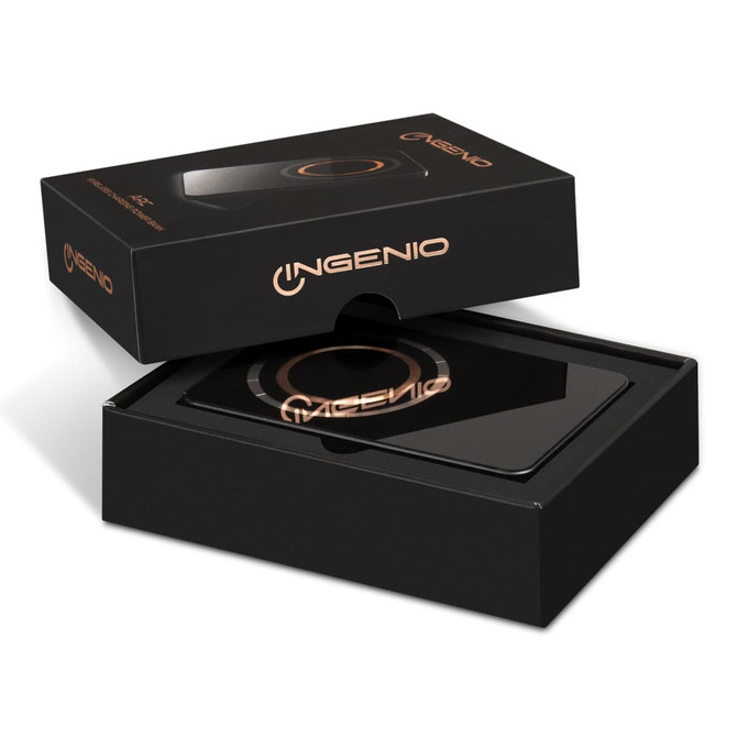 A black wireless charging power bank in its packaging, featuring a circular charging surface and a logo.