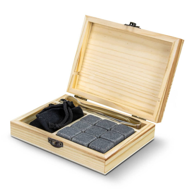 A wooden gift box containing grey whiskey stones, a black pouch, and a stainless steel tongs.