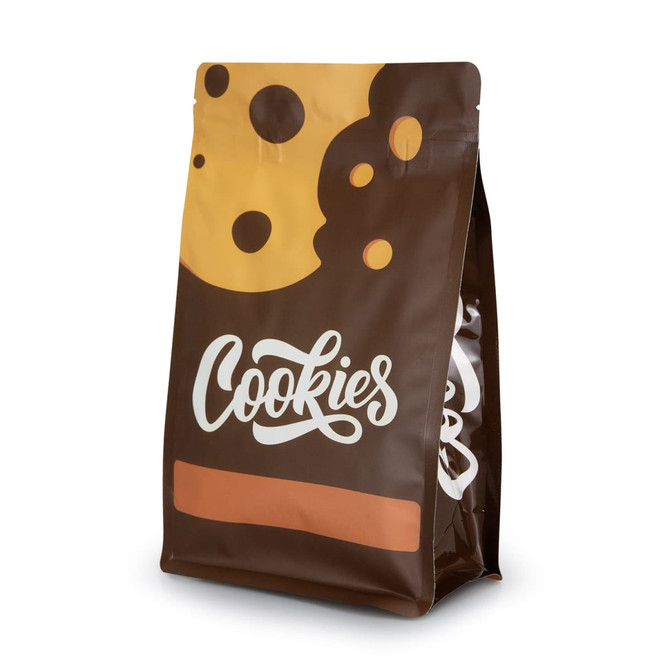 A small foil flat bottom pouch in brown with a cookie design and a logo on the front.