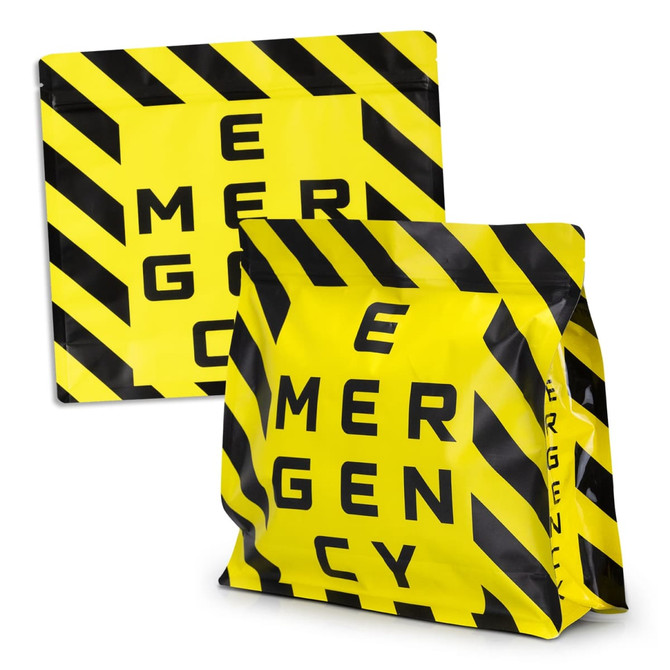A large foil flat bottom pouch in yellow and black with a striped design and a logo.