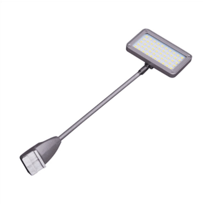 A black LED light with a rectangular head and flexible arm for positioning. It features a logo on the base.