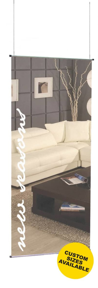 A vertical retail mesh banner featuring a modern living room scene with a white sofa and dark furnishings. It includes a logo.