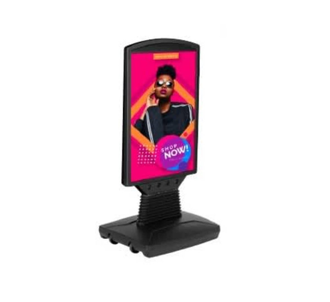 A black signage stand featuring a spring and water base, holding a Corflute display panel.